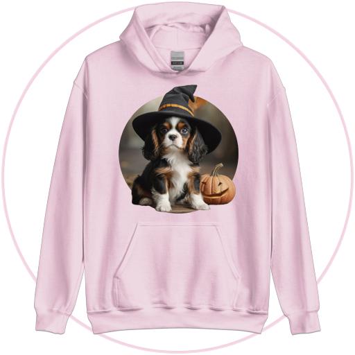 Cavalier pup learning magic in a Witches hat.